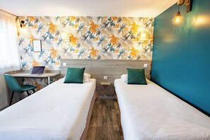A hotel room with two single beds, a desk with a laptop, and a chair. - KYRIAD VALENCIENNES SUD – Rouvignies (Rouvignies)