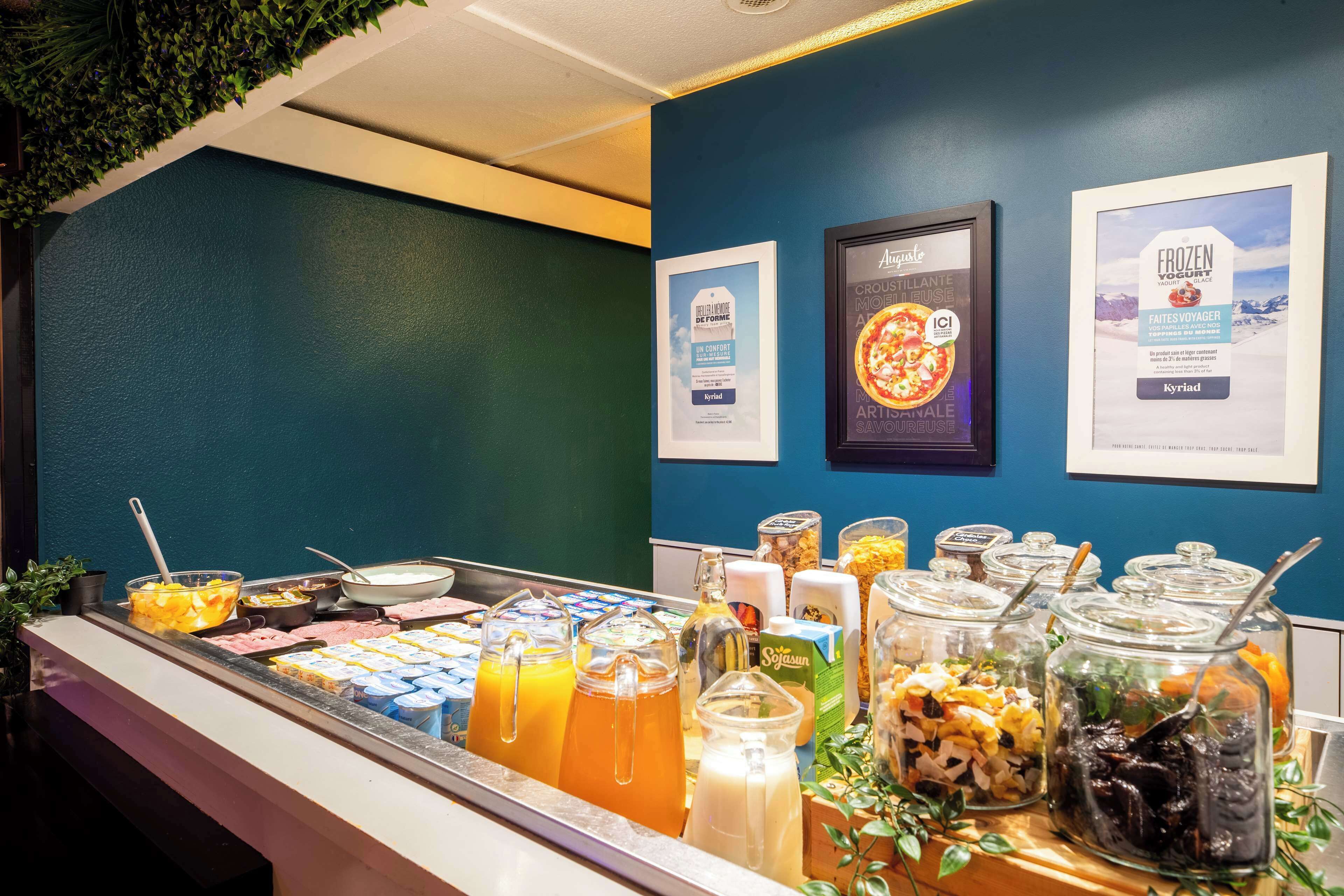 A breakfast buffet with various food items and beverages.