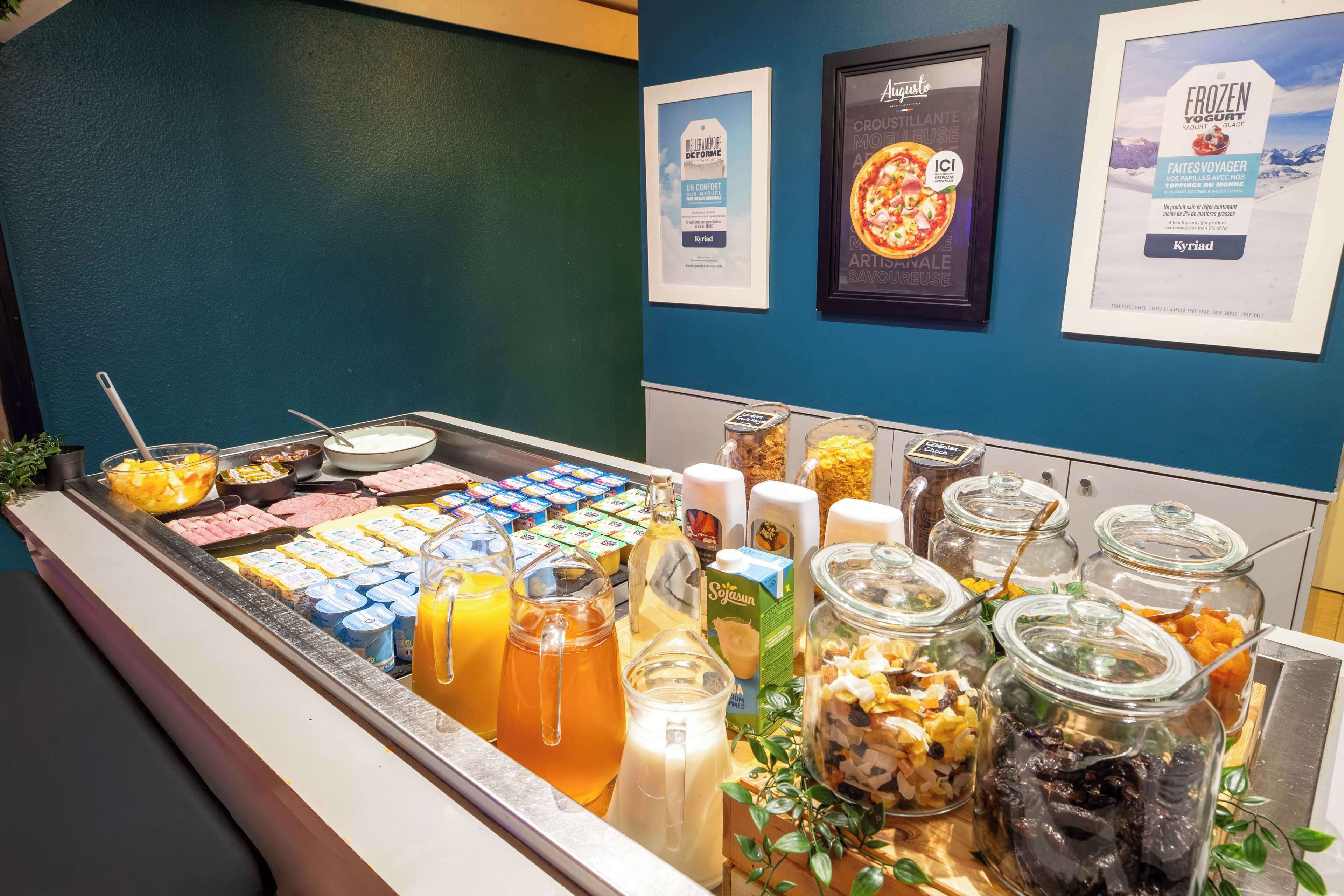 A breakfast buffet with various food items and beverages.
