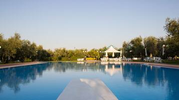 Outdoor pool, pool umbrellas, pool loungers