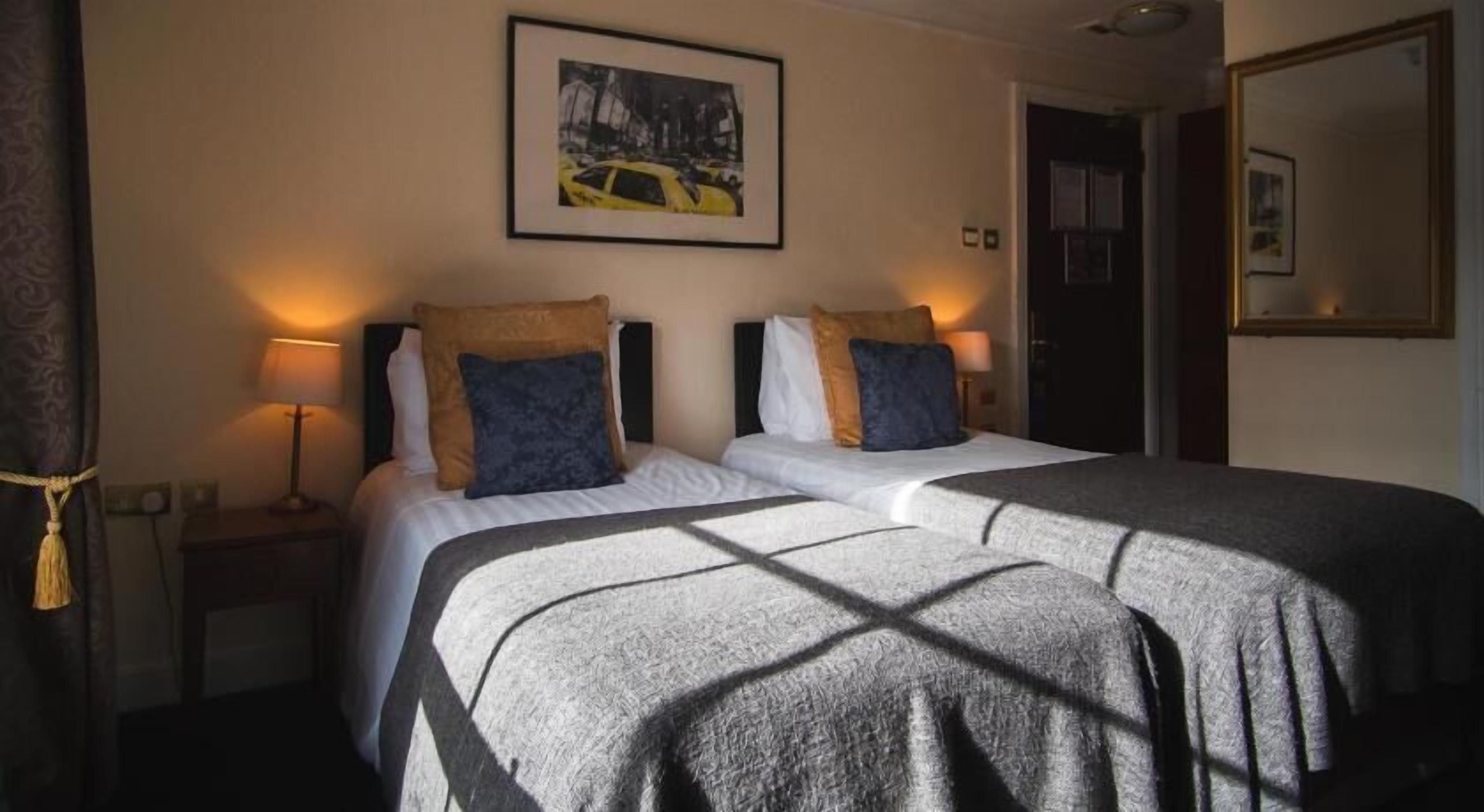 Hypo-allergenic bedding, desk, blackout drapes, iron/ironing board