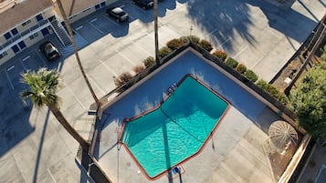 Outdoor pool, open 6:00 PM to 9:00 PM, sun loungers
