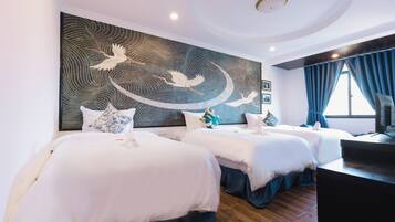Family Triple Room | Minibar, in-room safe, desk, blackout drapes