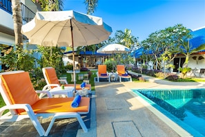 Outdoor pool, pool umbrellas, pool loungers