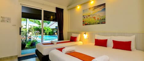 Chambre Triple Supérieure | Minibar, coffres-forts dans les chambres, rideaux occultants