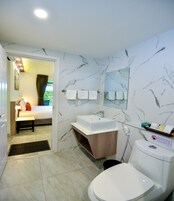 Superior Triple Room | Bathroom | Shower, eco-friendly toiletries, hair dryer, towels