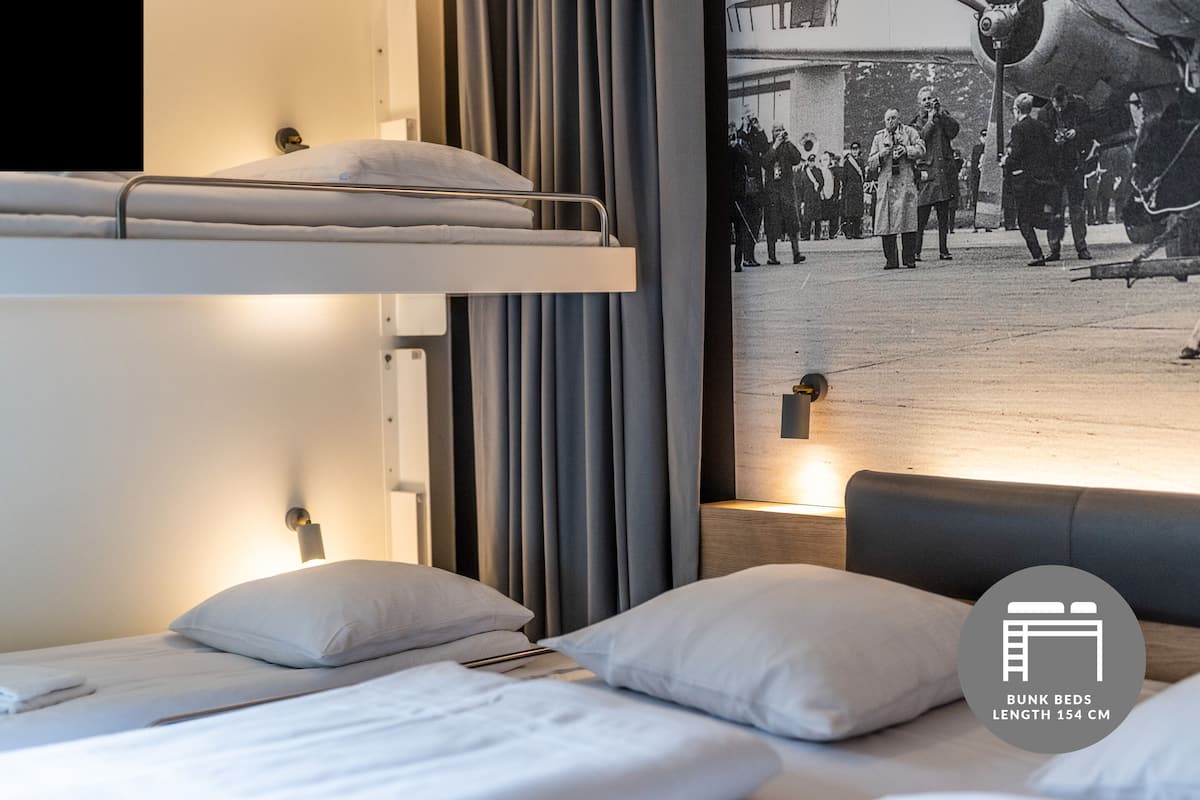 comfort room | hypo-allergenic bedding, desk, laptop workspace, soundproofing