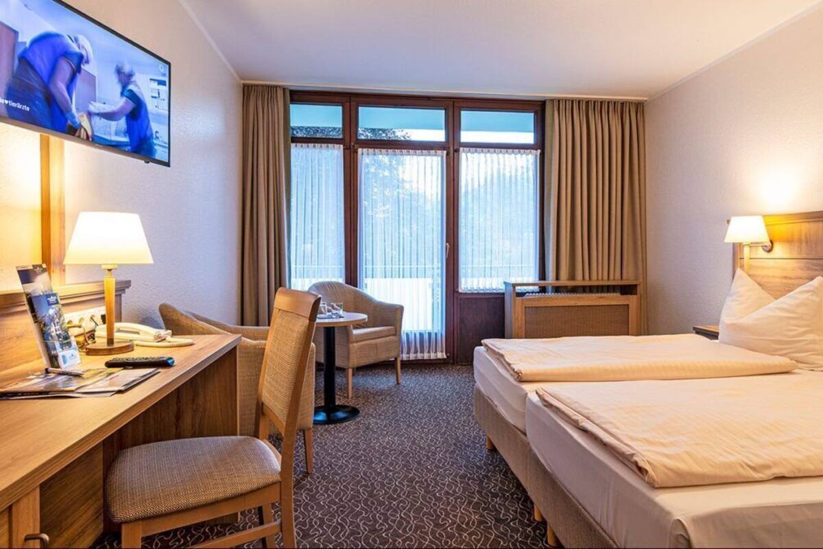 Hypo-allergenic bedding available, in-room safe, desk, laptop workspace