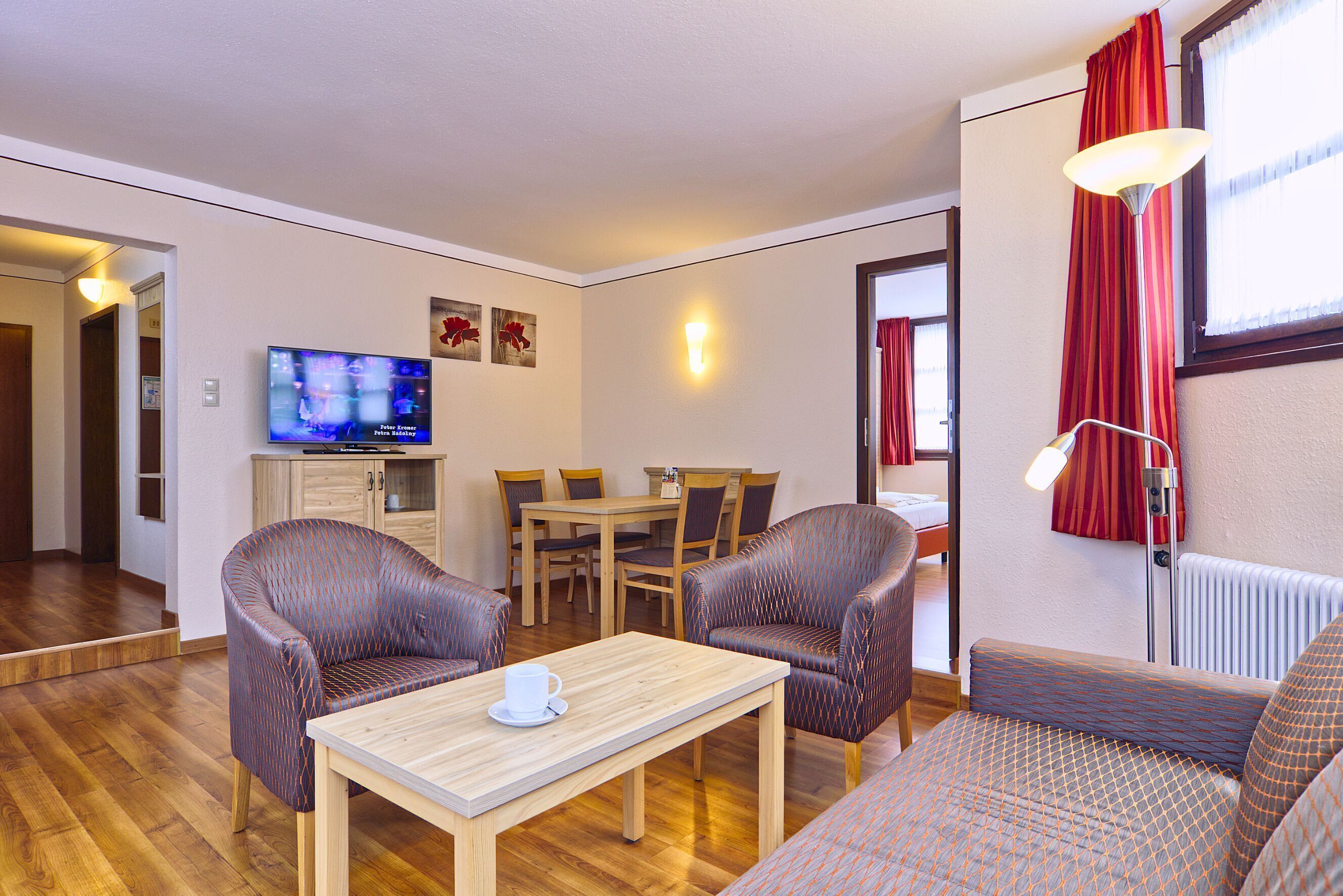 Deluxe Suite | Living area | Flat-screen TV