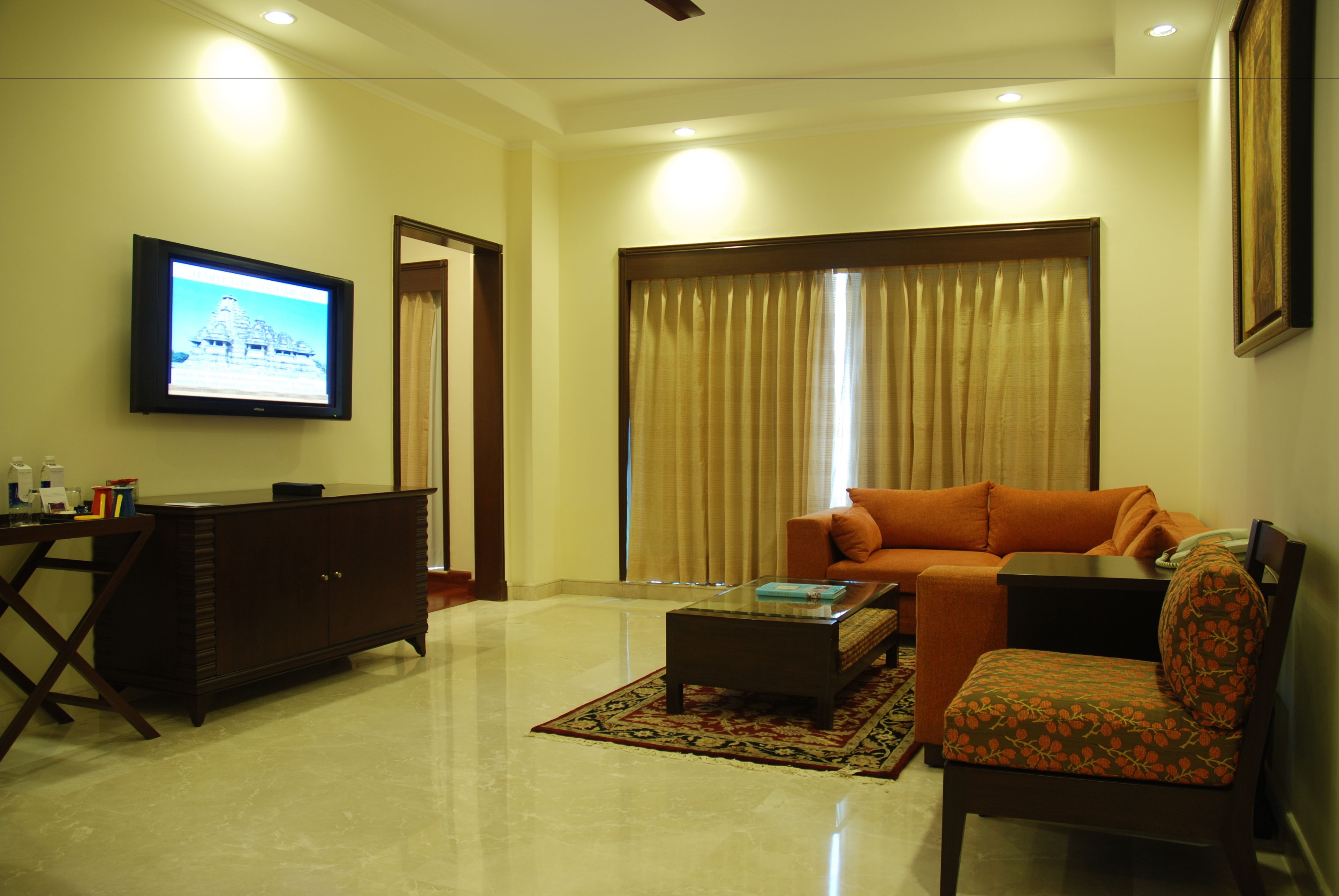 room (lalit legacy first floor) | living area | 42-inch plasma tv with cable channels, tv, dvd player