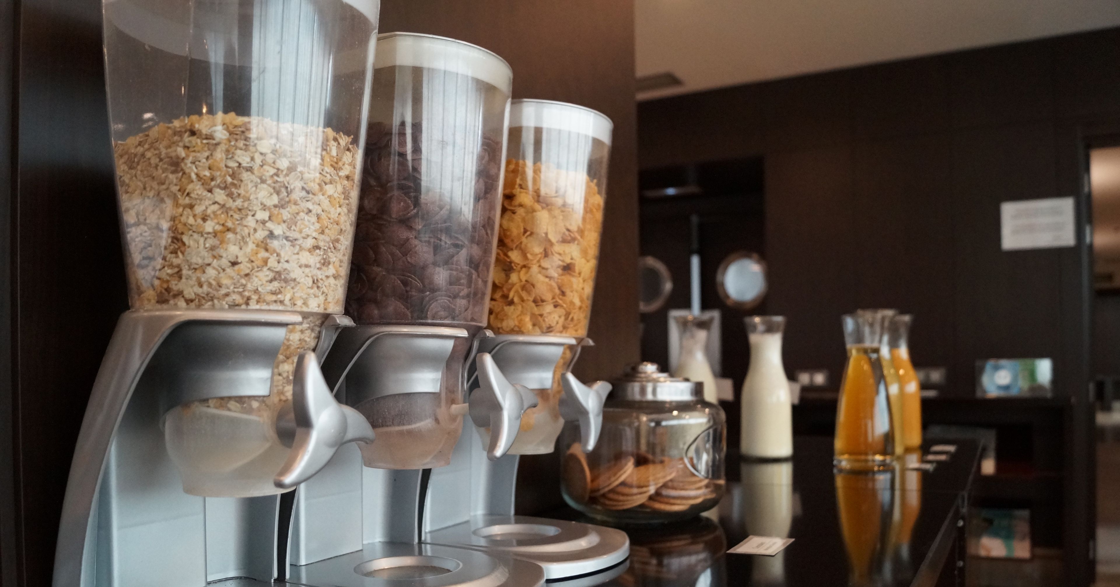 A coffee machine with multiple dispensers for different types of coffee.