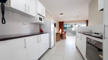 Suite, 1 Bedroom | Private kitchen | Fridge, microwave, stovetop, dishwasher
