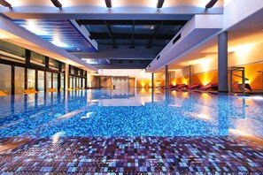 Indoor pool, seasonal outdoor pool, pool umbrellas, pool loungers