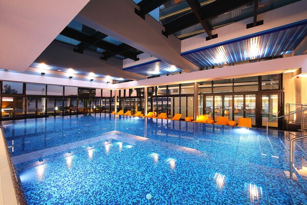 Indoor pool, seasonal outdoor pool, pool umbrellas, pool loungers