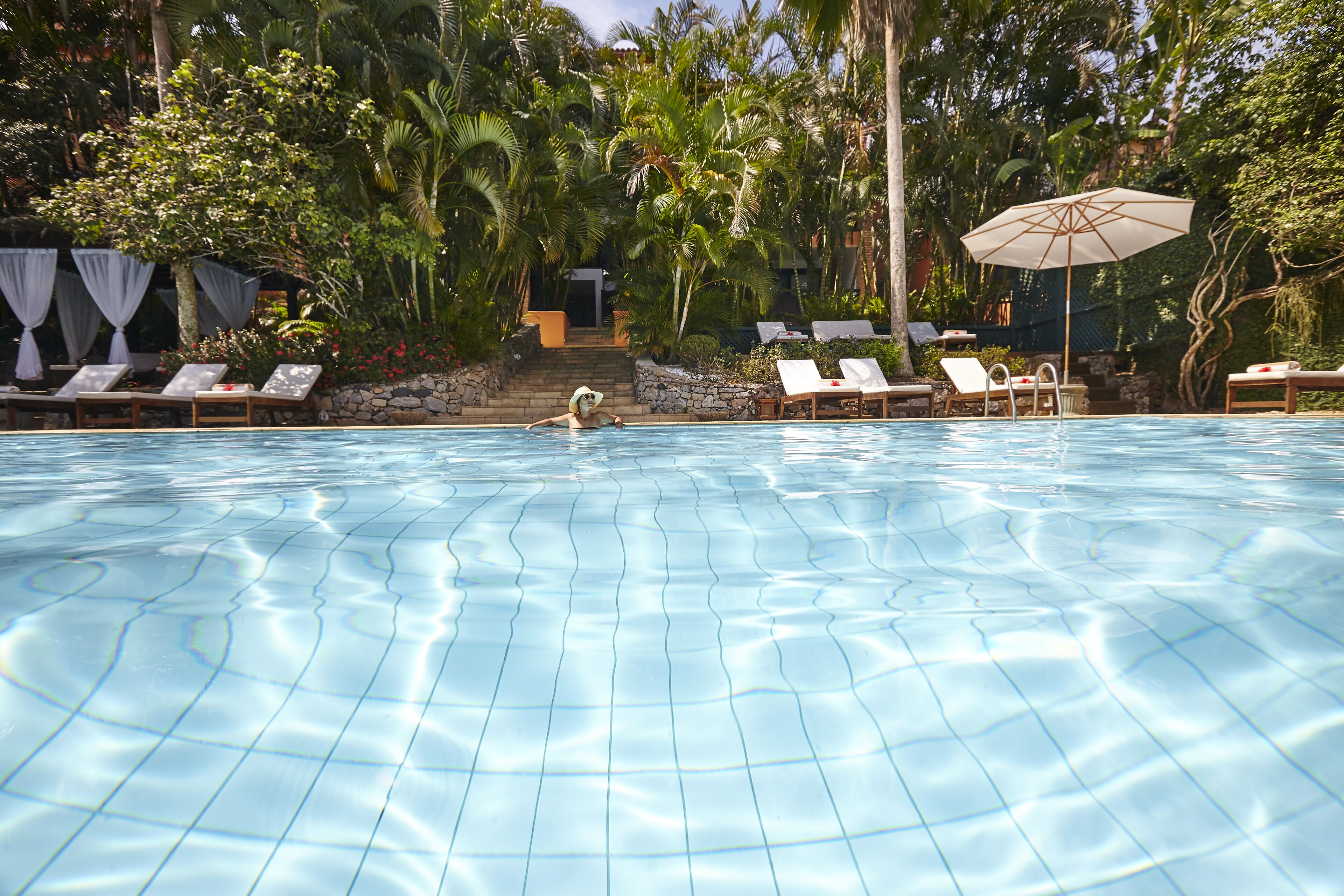 outdoor pool, pool umbrellas, pool loungers