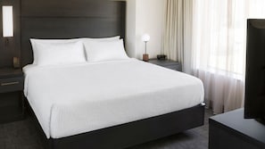 Premium bedding, desk, laptop workspace, iron/ironing board