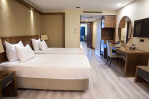 Family Room, 1 King Bed | Minibar, in-room safe, desk, iron/ironing board