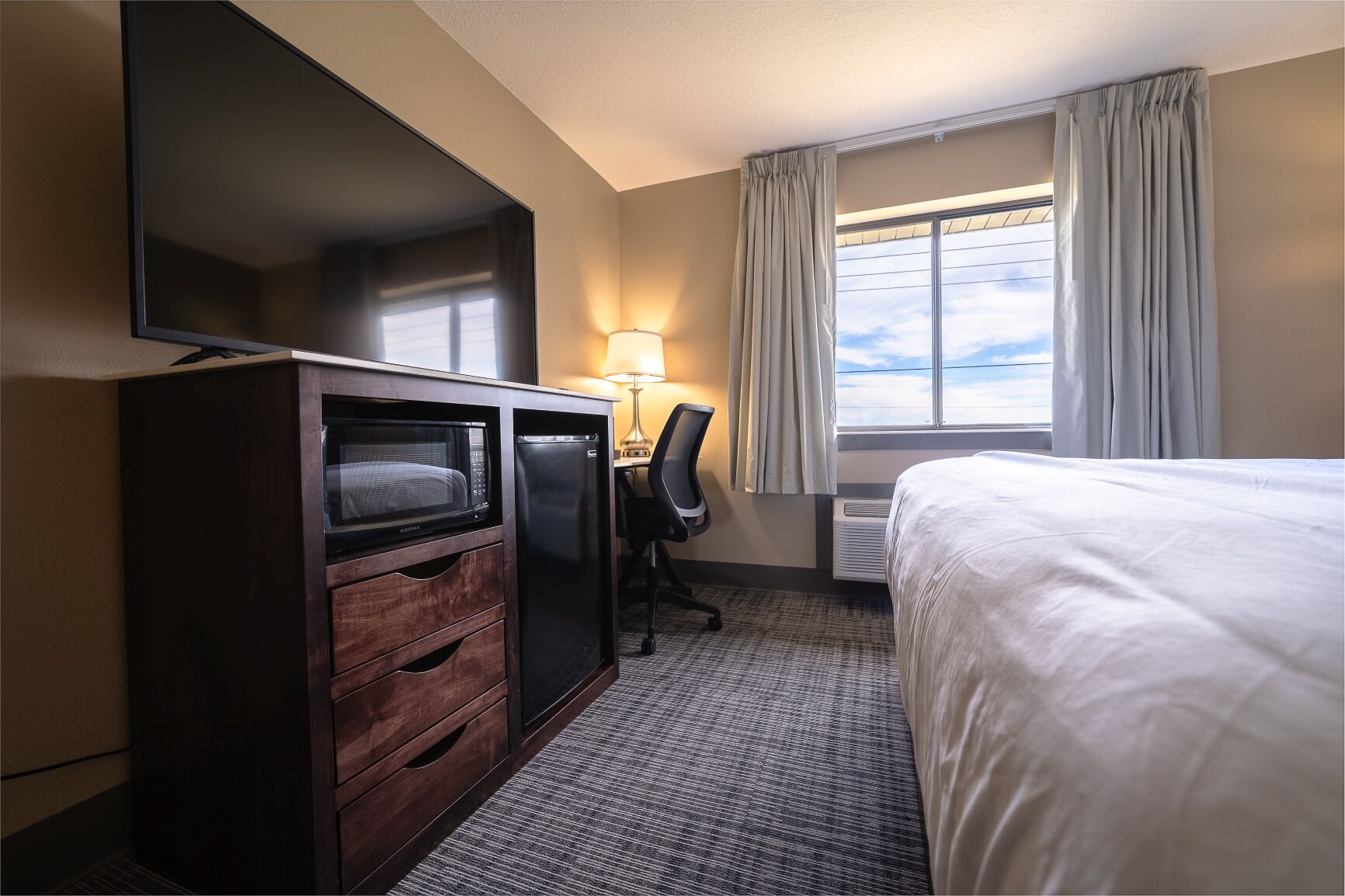 desk, laptop workspace, blackout curtains, iron/ironing board