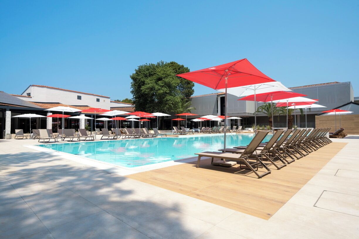 Indoor pool, seasonal outdoor pool, pool umbrellas, pool loungers