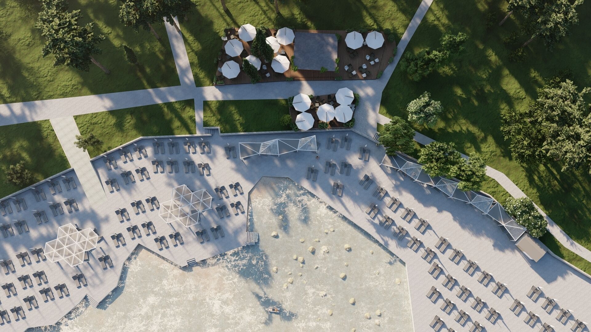 An aerial view of a resort with a pool area, sun loungers, and a covered seating area with umbrellas.