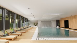 A modern indoor swimming pool with lounge chairs and a stone wall. - Hotel Pelegrin Plava Laguna (Umag)