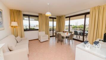 Apartment, 2 Bedrooms, Lake View | Living area | Flat-screen TV