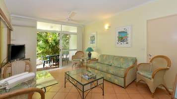 Apartment, 1 Bedroom | Living room | Flat-screen TV