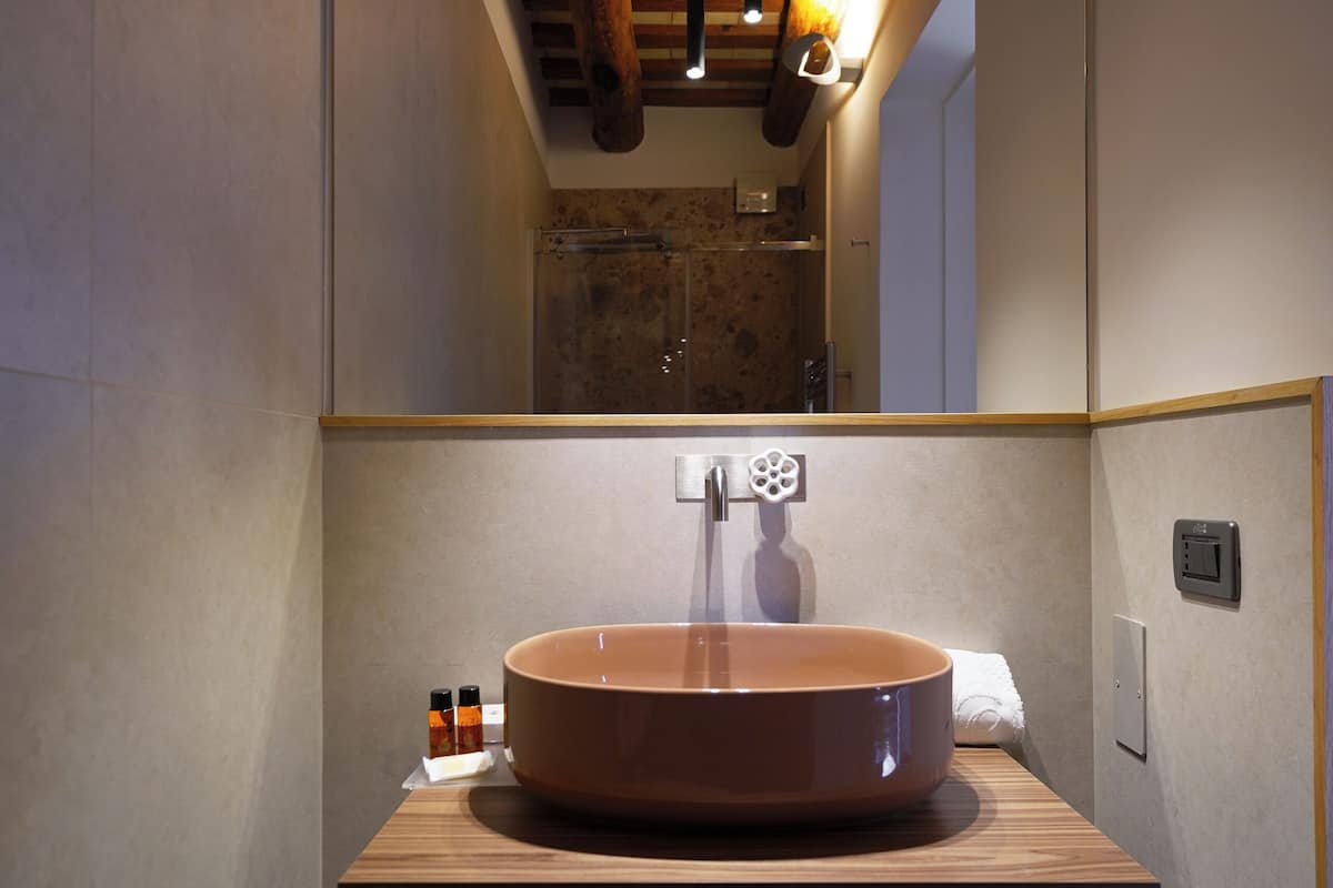 junior studio suite | bathroom | free toiletries, slippers, bidet, towels