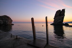 On the beach, sun loungers, beach umbrellas, beach towels