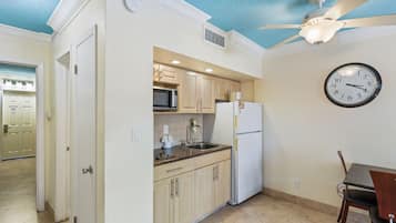 One Bedroom Suite: 1 Queen Bed and 1 Sleeper Sofa | Private kitchenette | Full-size fridge, microwave, stovetop, coffee/tea maker