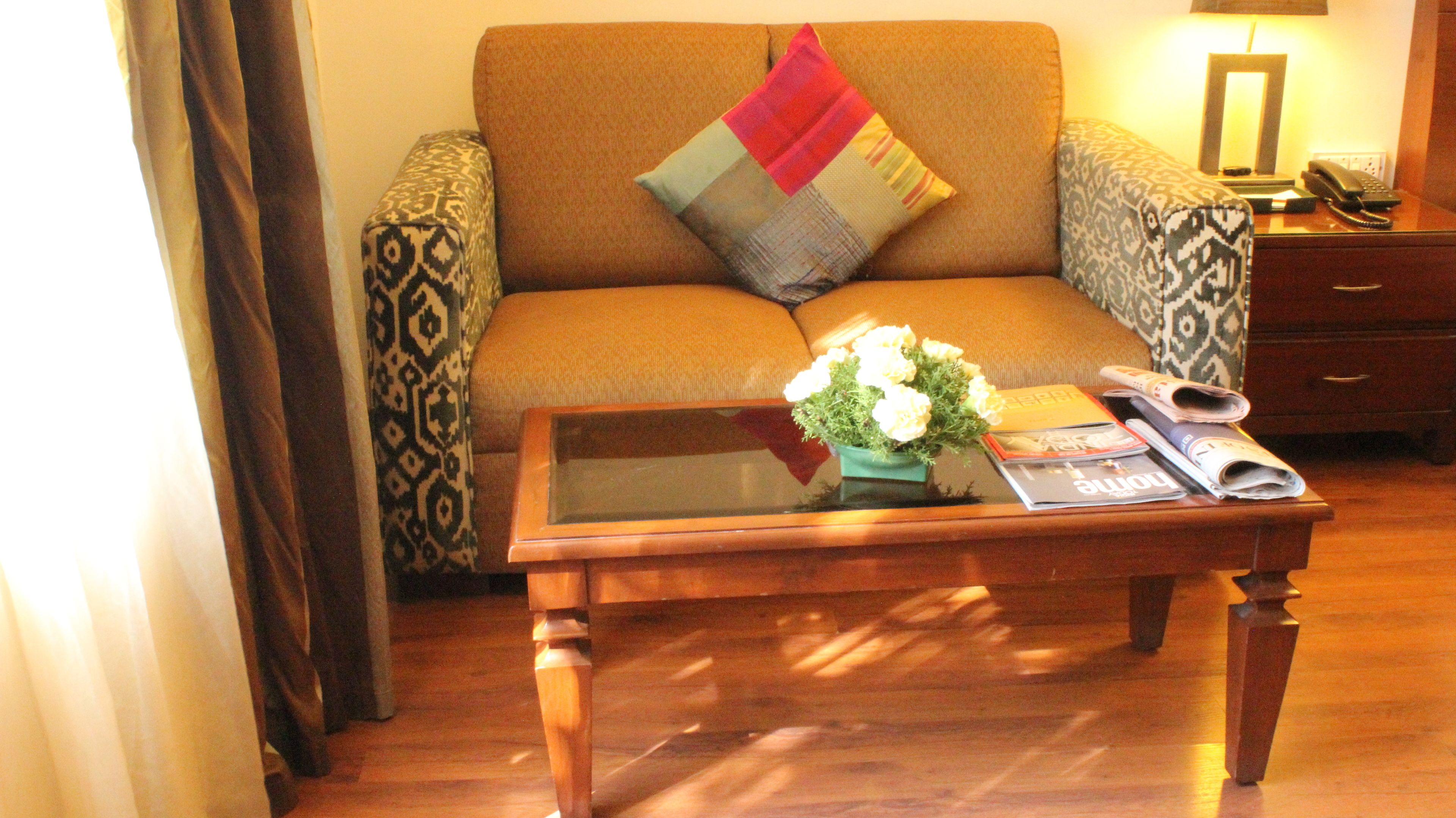 deluxe room, 1 double bed | living area | tv, dvd player