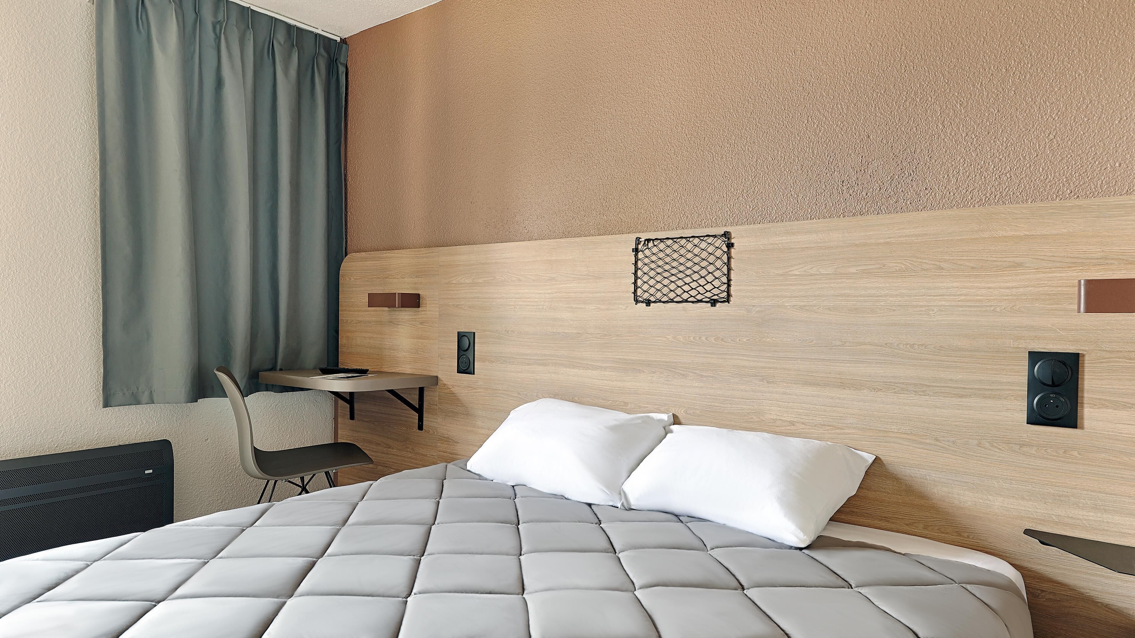Desk, blackout curtains, free WiFi, bed sheets