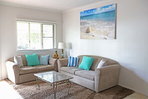 32-inch flat-screen TV with cable channels, LCD TV