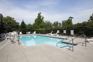 Seasonal outdoor pool, open 8:00 AM to 9:00 PM, pool loungers