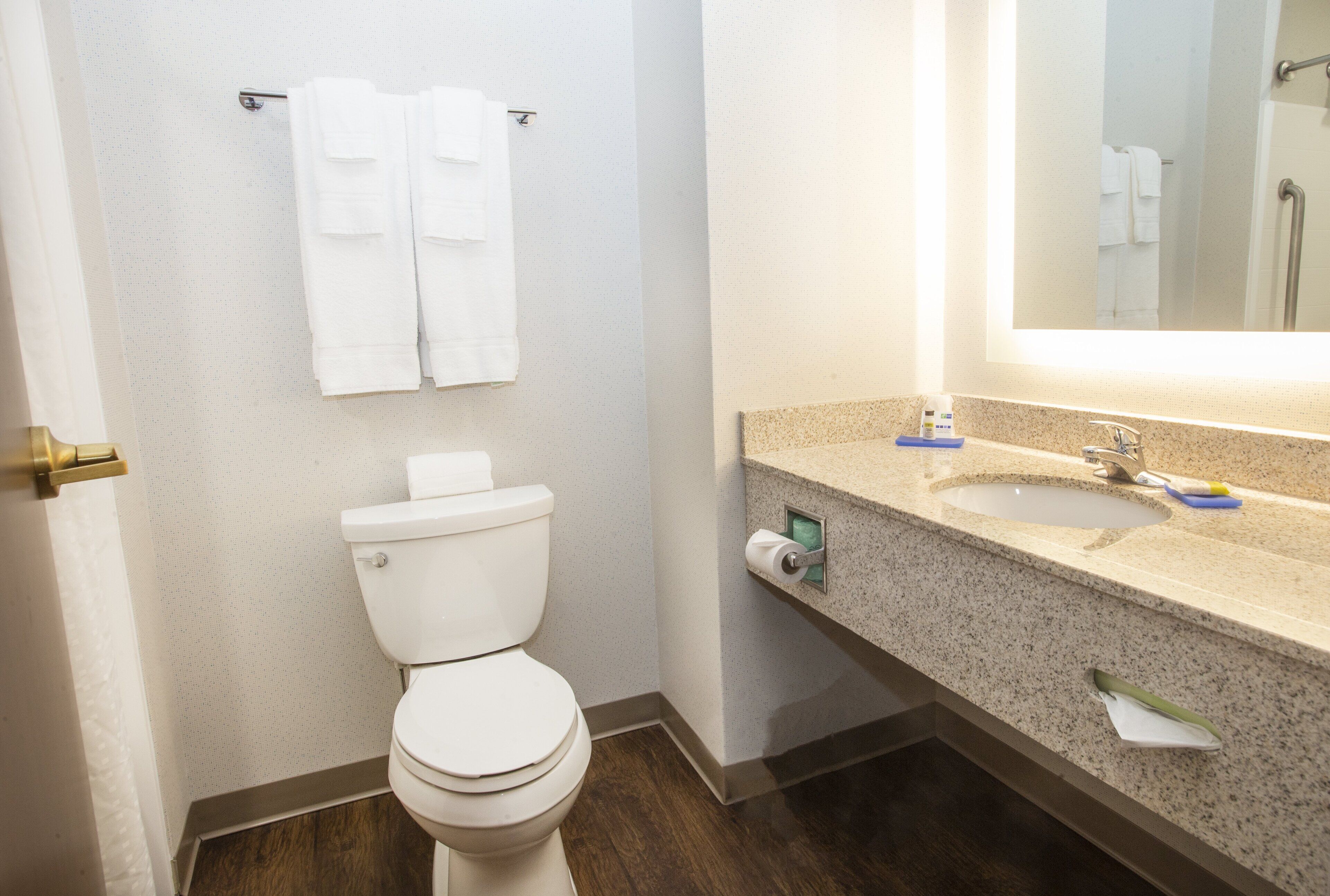 combined shower/bathtub, designer toiletries, hair dryer, towels