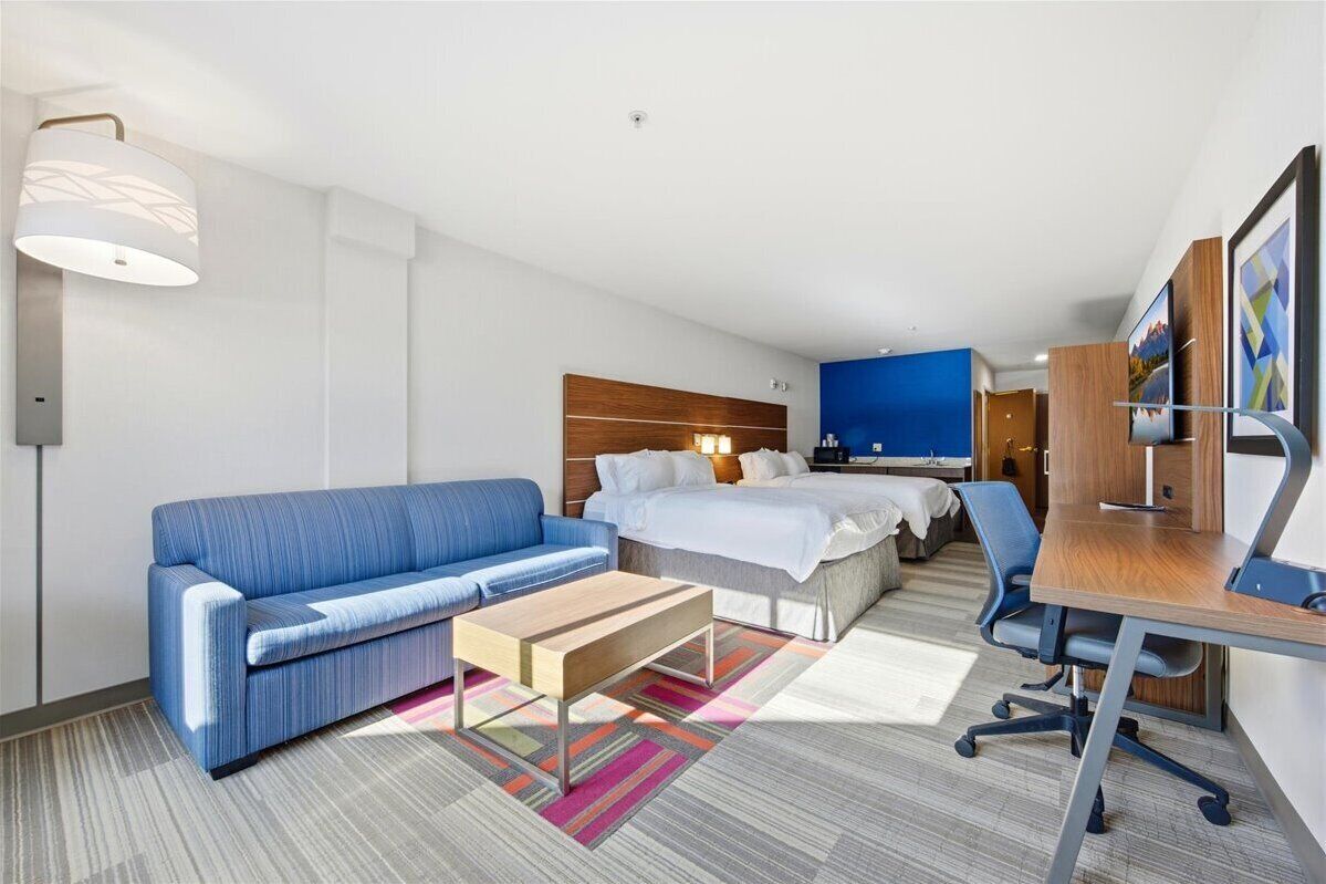 Desk, laptop workspace, blackout drapes, iron/ironing board