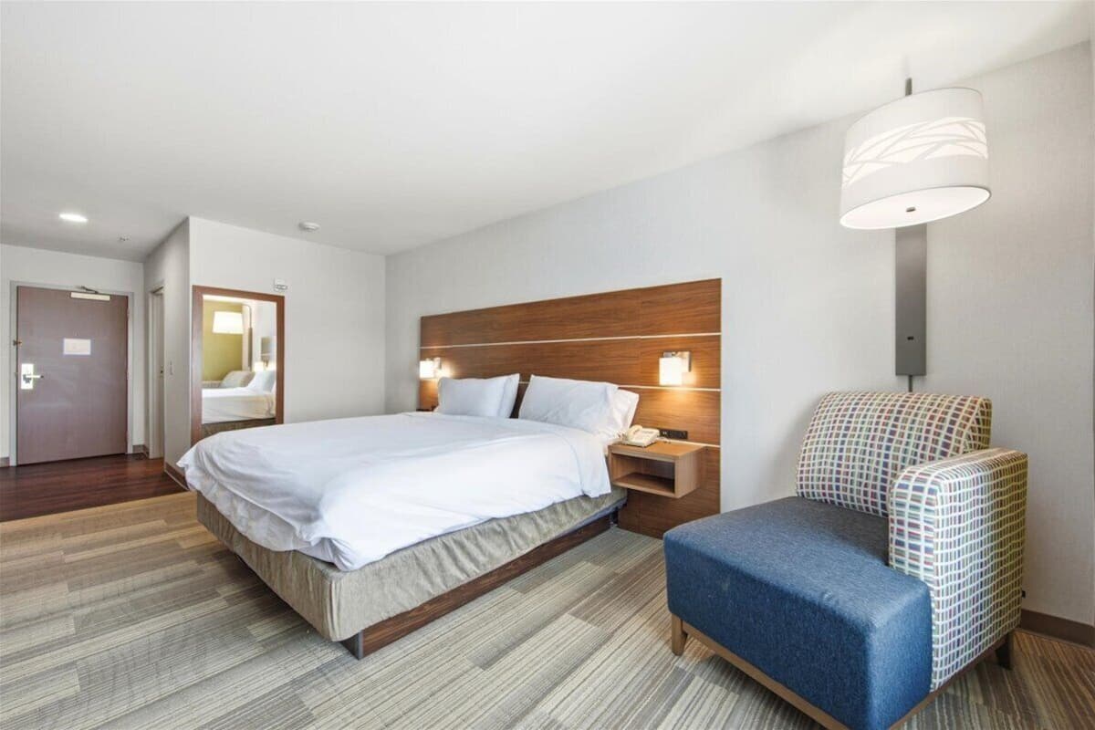 Desk, laptop workspace, blackout drapes, iron/ironing board