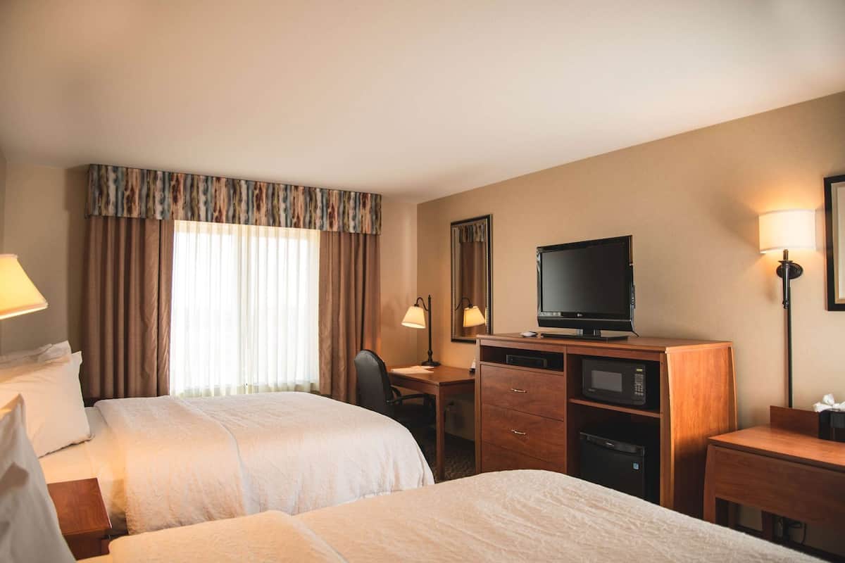 Premium bedding, down duvets, blackout curtains, iron/ironing board
