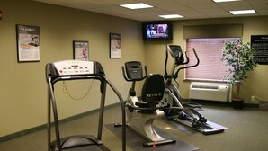A fitness center with treadmills, an elliptical, and a stationary bike.
