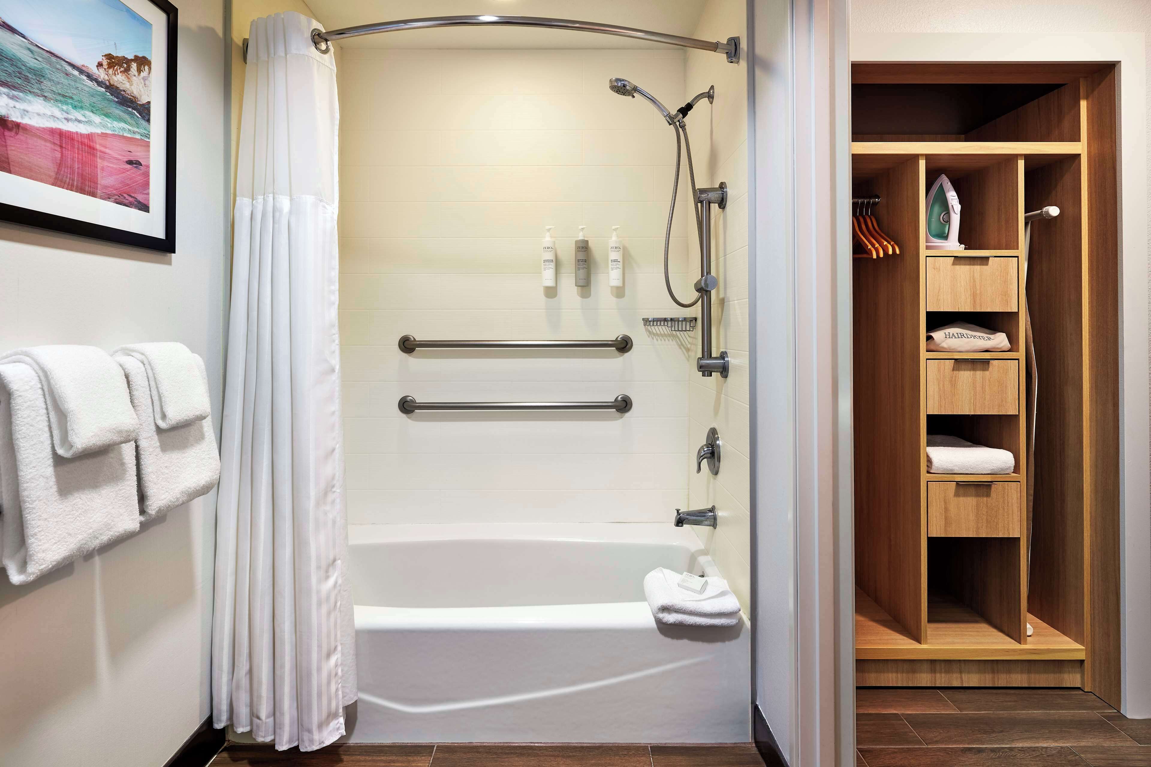 combined shower/bathtub, free toiletries, hair dryer, towels