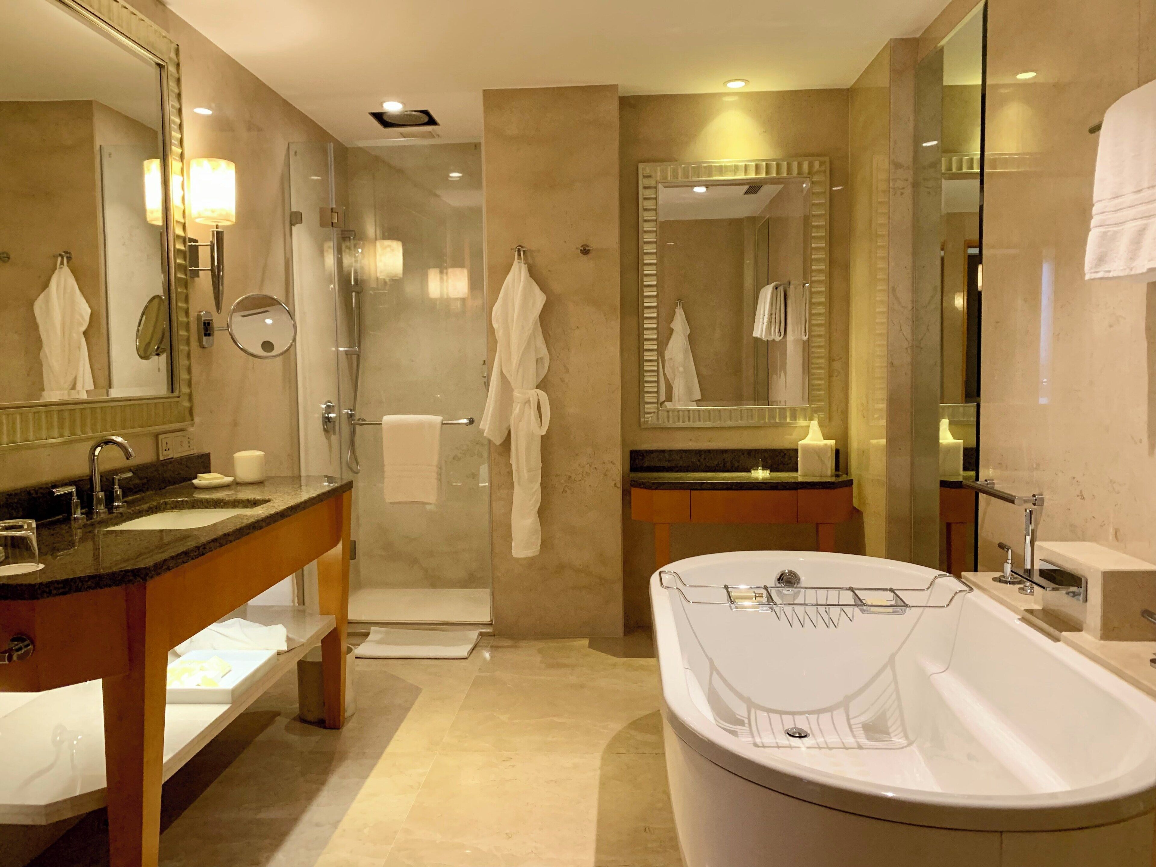 separate bathtub and shower, deep-soaking bathtub, rainfall showerhead