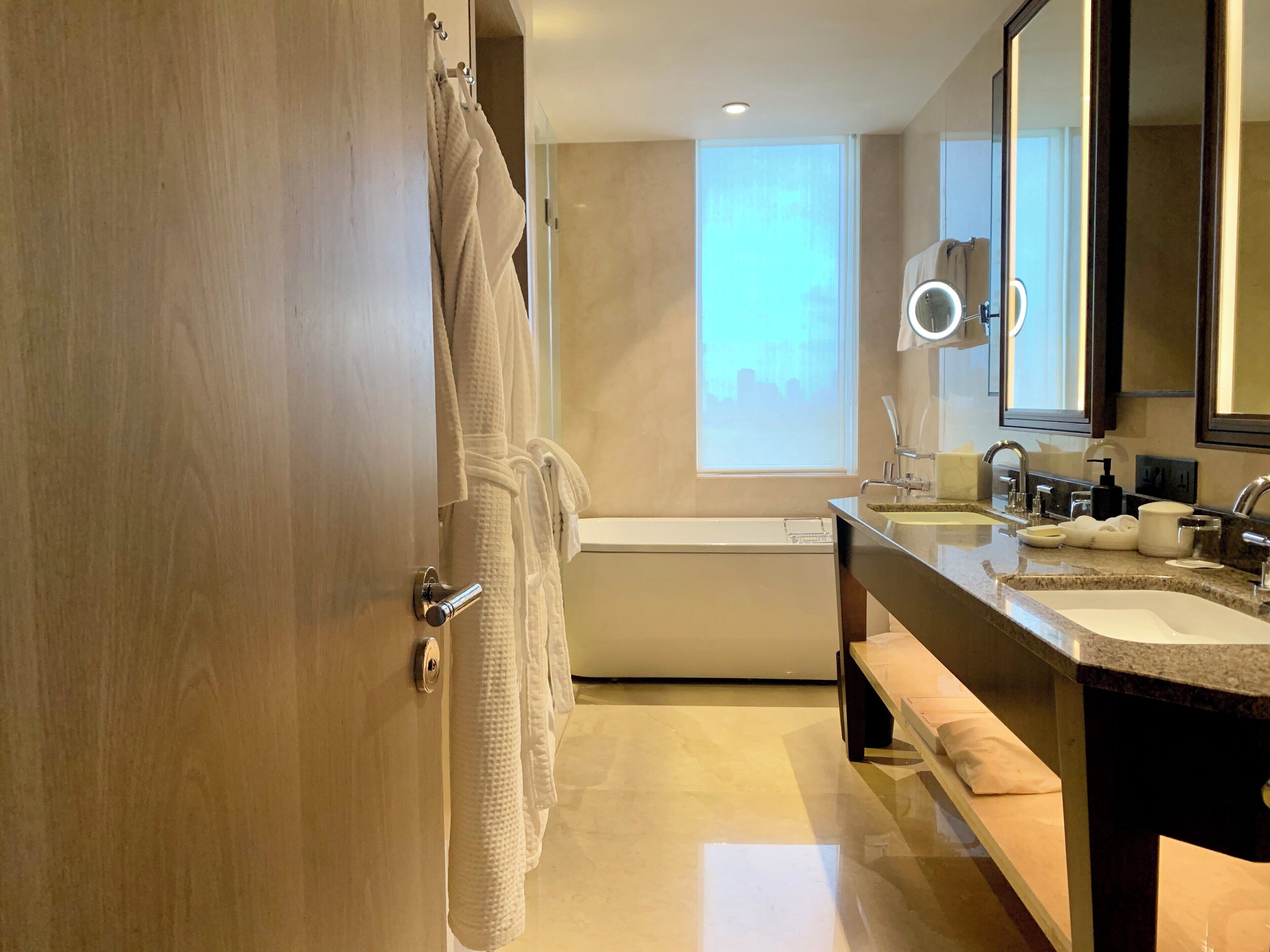 separate bathtub and shower, deep-soaking bathtub, rainfall showerhead