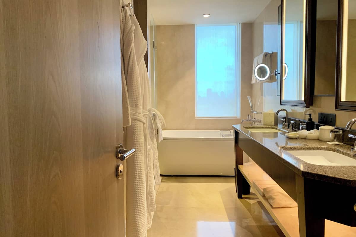 separate bathtub and shower, deep-soaking bathtub, rainfall showerhead