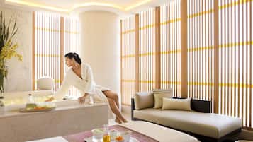Relax in style with a serene spa experience, featuring a plush sofa, elegant reception desk, and soothing ambiance.