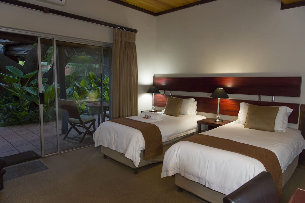 Standard Room, 1 Bedroom (Rm 11, Twin beds/king bed, garden acc) | 1 bedroom, minibar, in-room safe, desk