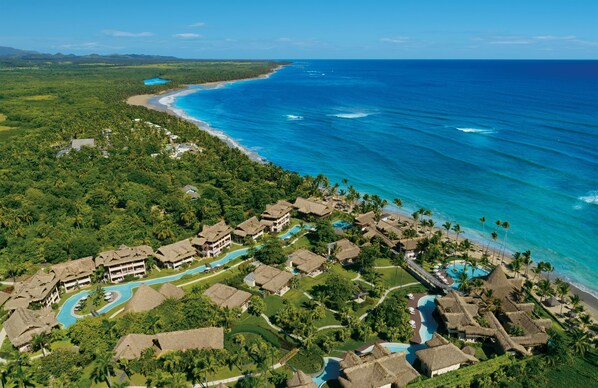 A resort with multiple buildings, a swimming pool, and a beach. - Zoetry Agua Punta Cana - All Inclusive (Punta Cana)