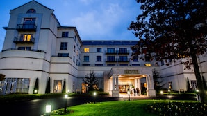 A hotel with a central entrance, multiple balconies, and a well-maintained garden. - Knightsbrook Hotel Spa & Golf Resort (Trim)