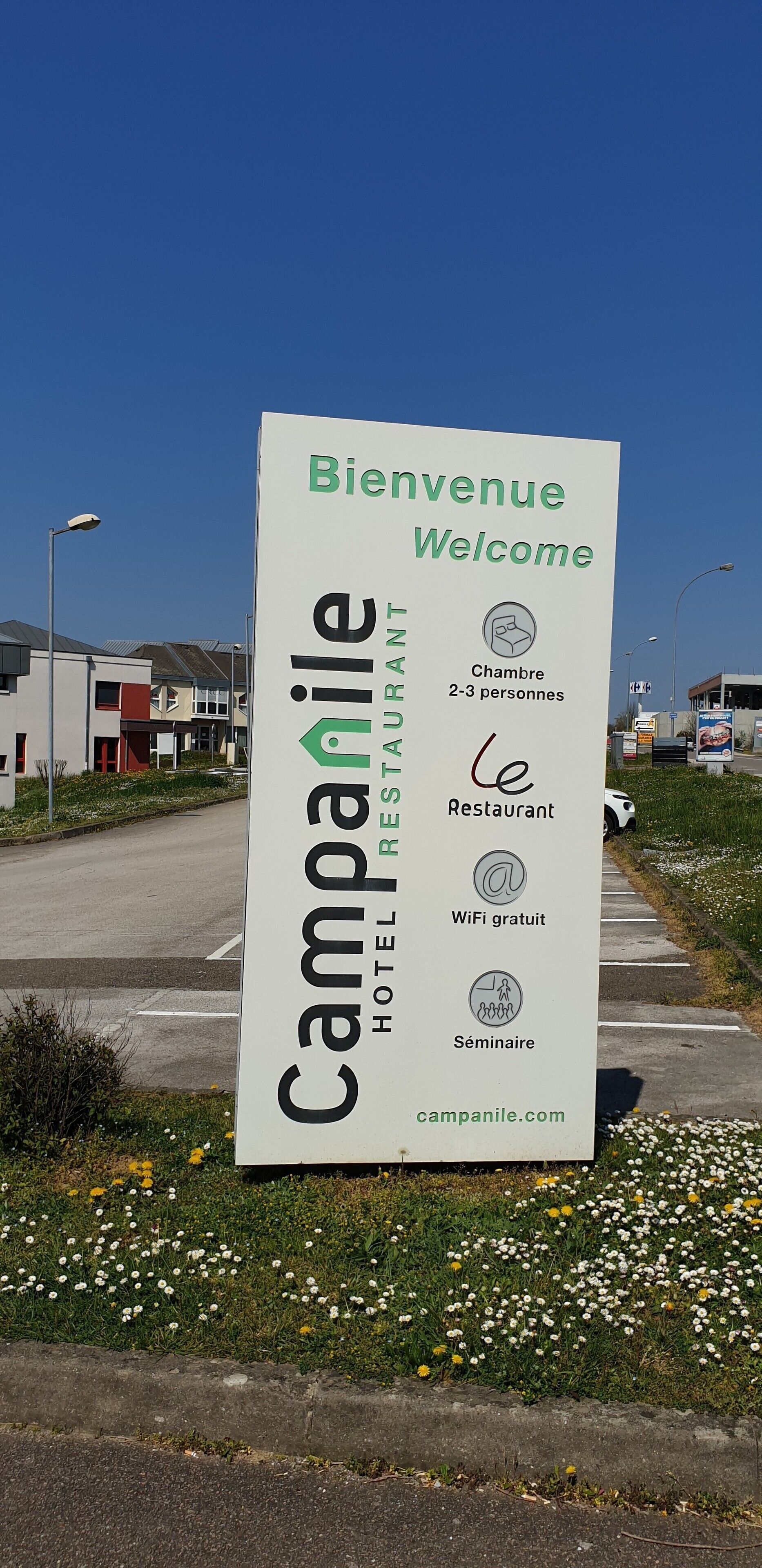 A sign for Campanile Hotel Restaurant, indicating it is a restaurant, offers free WiFi, and has a seminar room.