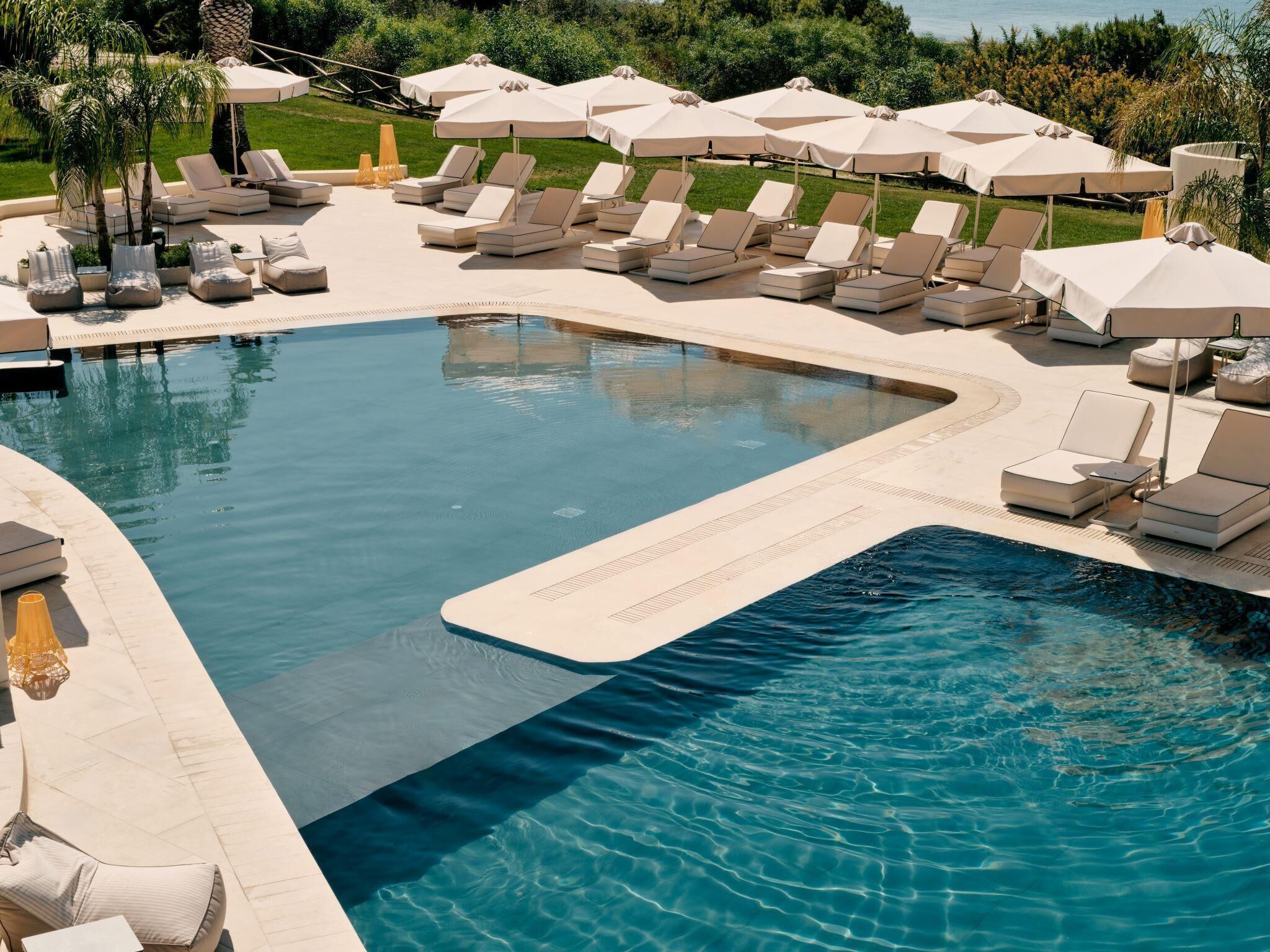 indoor pool, outdoor pool, pool umbrellas, pool loungers