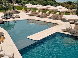 Indoor pool, outdoor pool, pool umbrellas, pool loungers